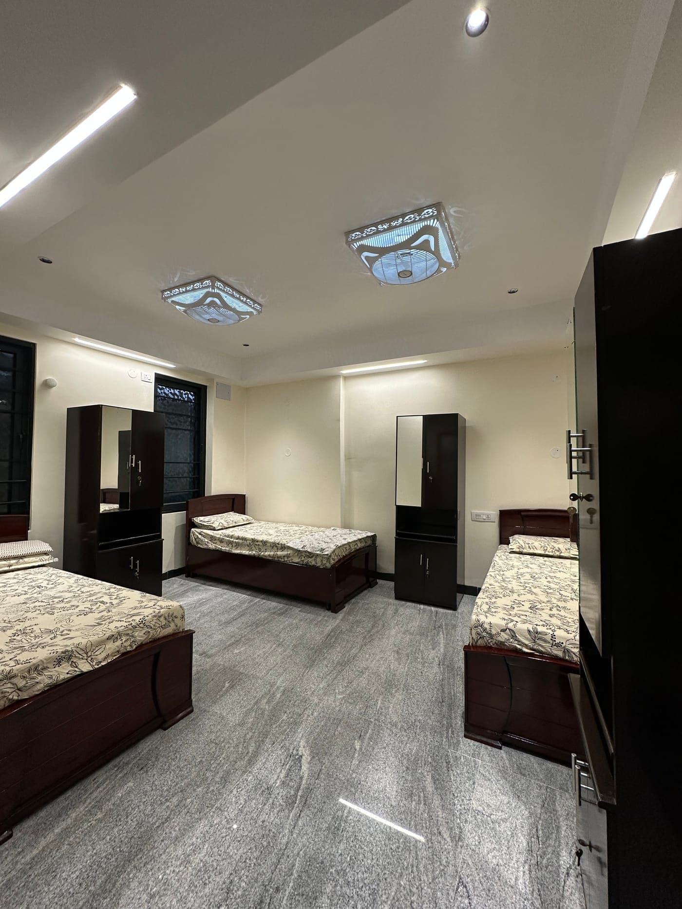 Three single beds with wardrobes